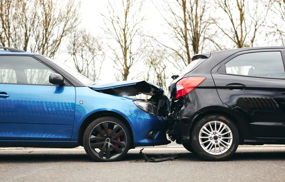 Rear-end collision showing vehicle damage after a car accident Rear-end collision showing vehicle damage after a car accident