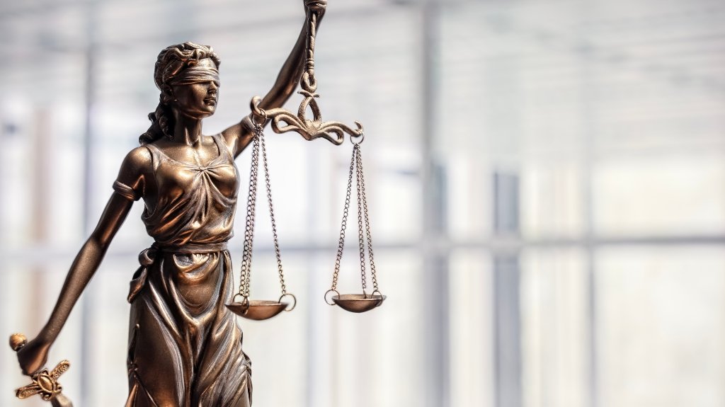statue of Lady Justice with scales of justice_s Can You File a Nursing Home Lawsuit Without Power of Attorney in Illinois?