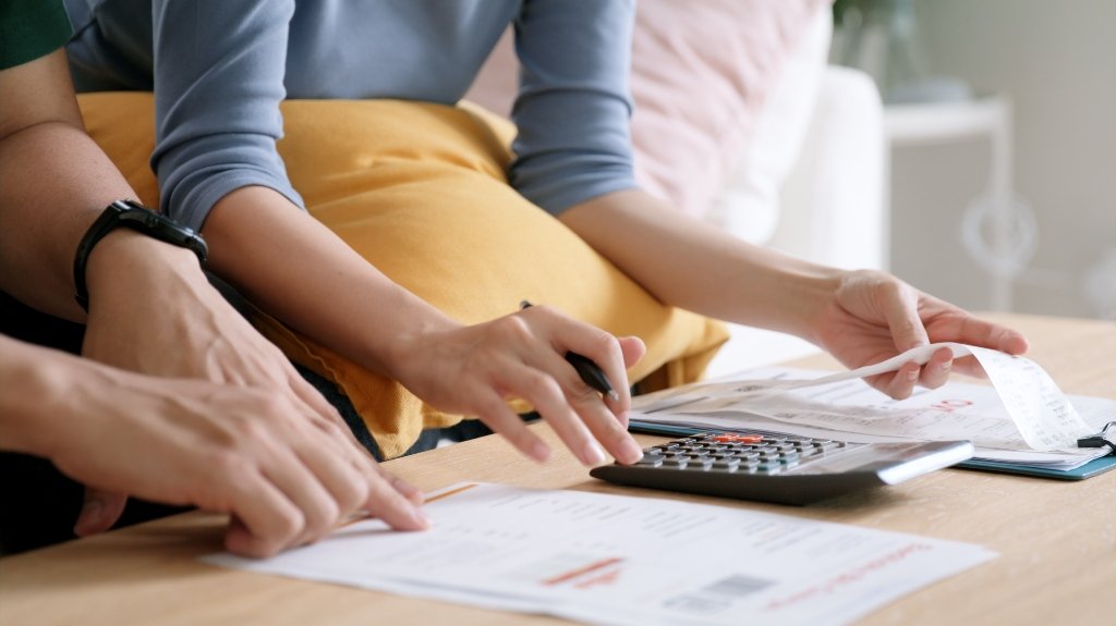 woman calculating medical bills_s woman calculating medical bills