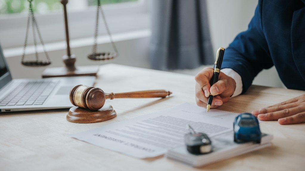 Judge male hand with car and documents and hammer_s