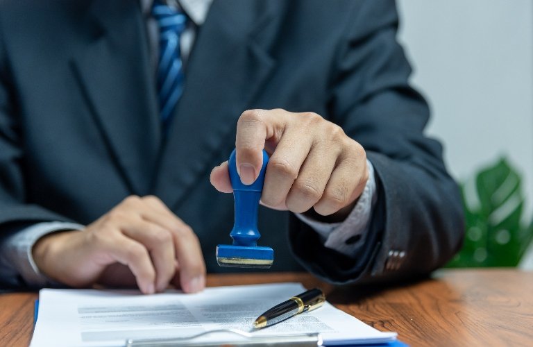 lawyer is putting stamp on the document